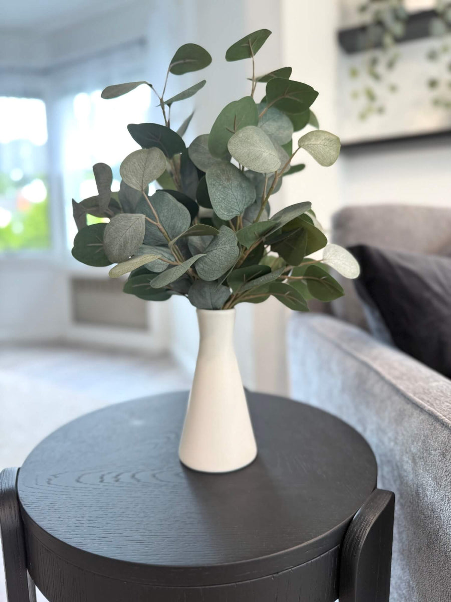 elegant faux silver dollar eucalyptus in white ceramic vase