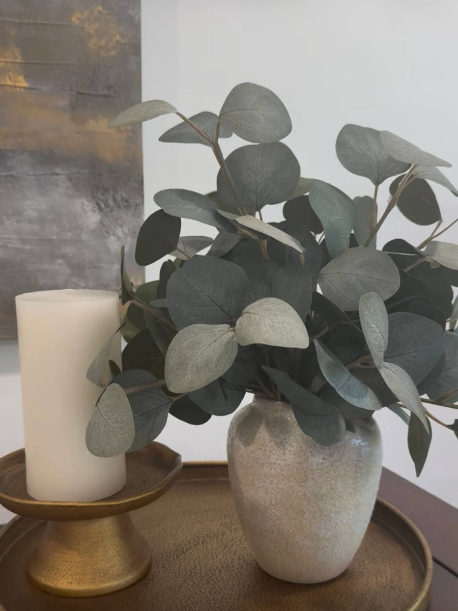 elegant realistic silver dollar eucalyptus in ceramic vase