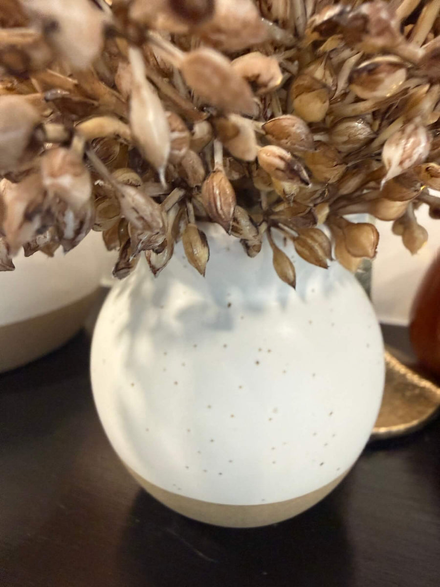 close up of vase for elegant lush realistic beige-brown wheat arrangement is small ivory beige vase