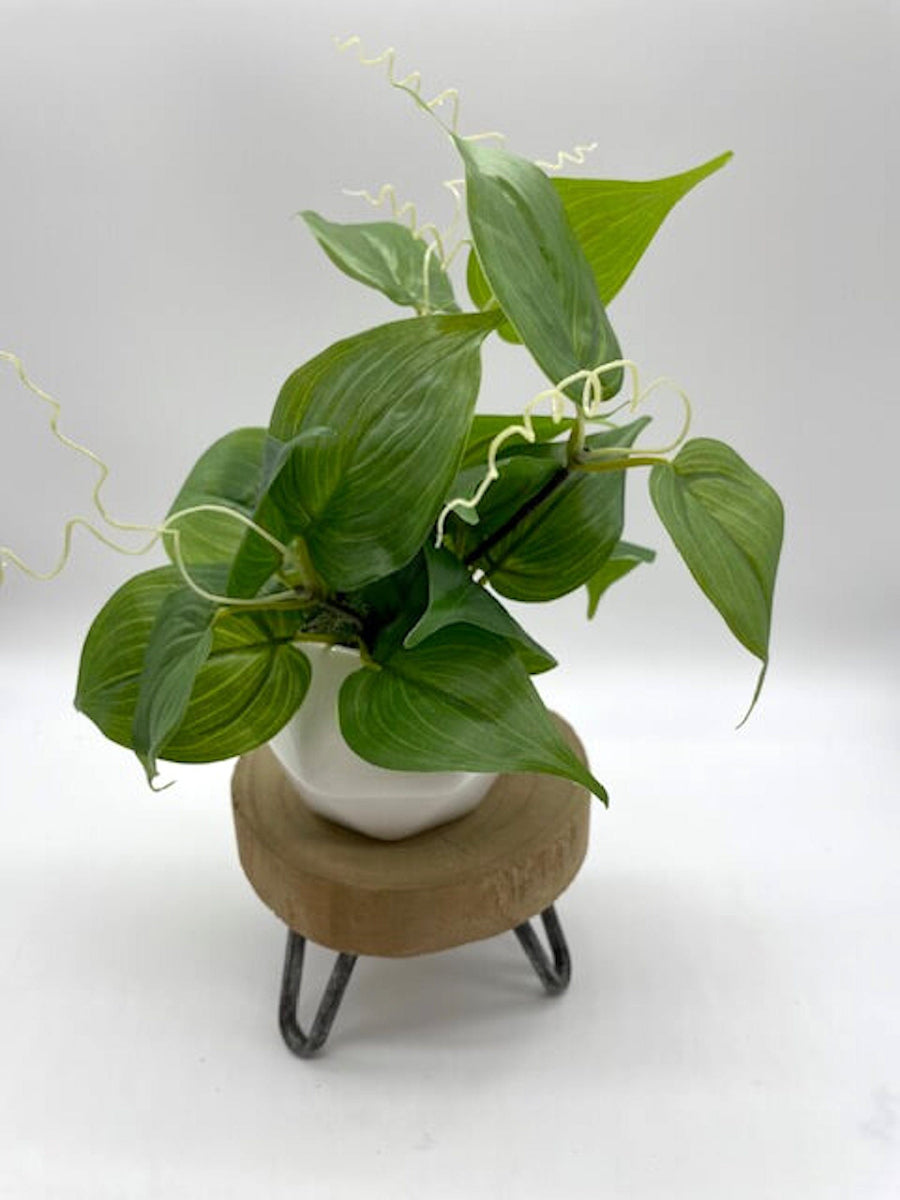 realistic artificial green leaves plant in white ceramic pot