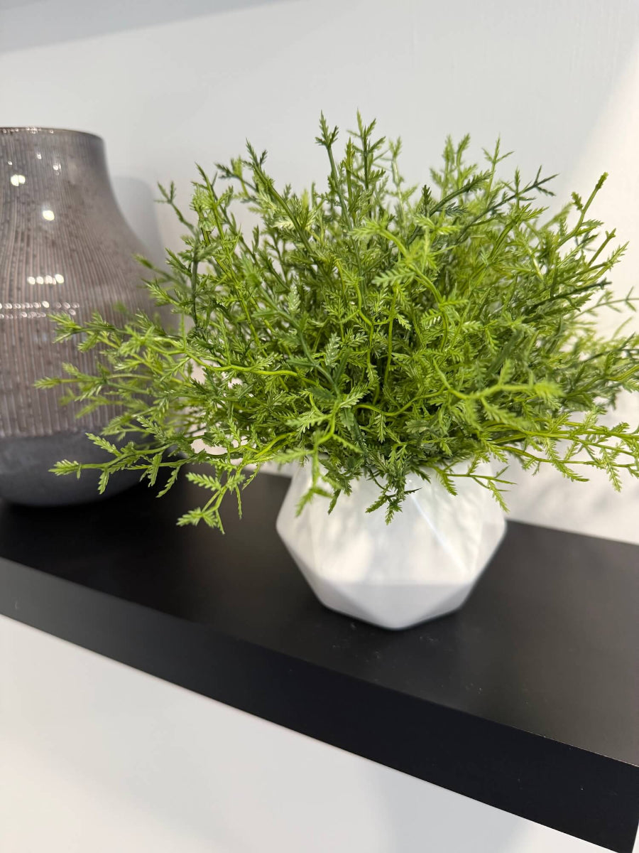 realistic looking small artificial fern planti white ceramic geometric shape pot vase styled on shelf