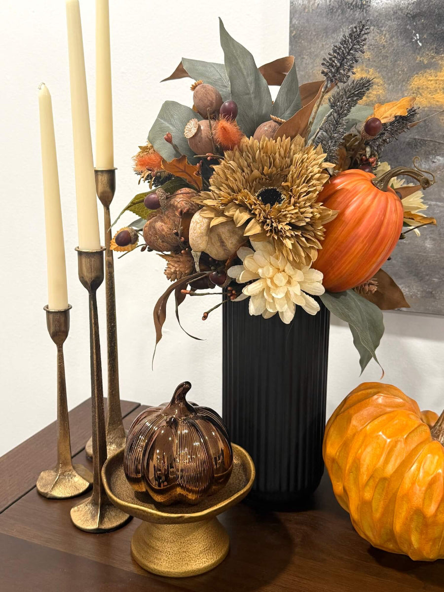 elegant lush realistic rich in fall accents tall autumn arrangement with pumpkins, fall laves, berries, flowers in black textured ceramic vase
