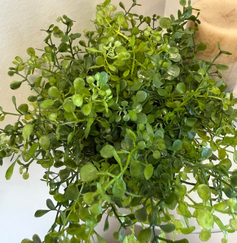 small realistic looking vivid faux greenery in geometric black matte pot vase