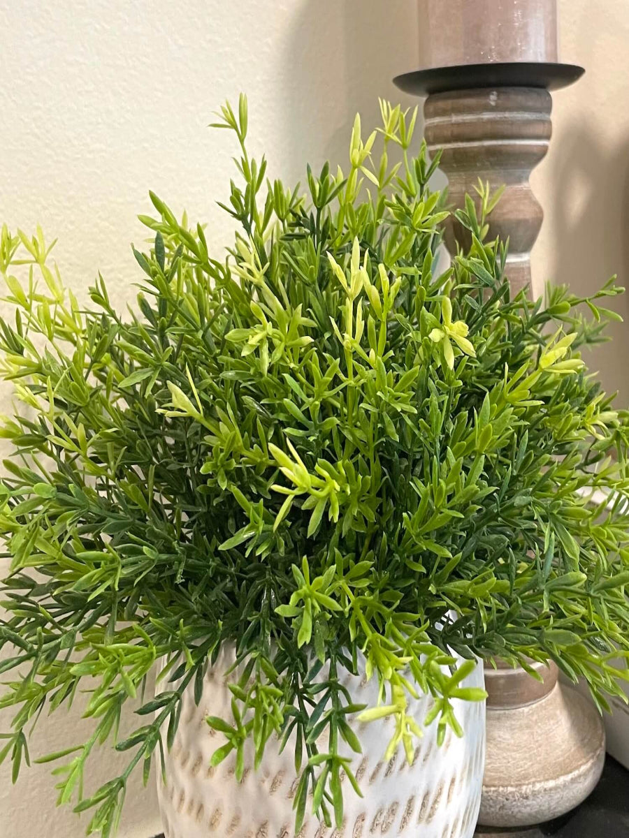 realistic looking faux vivid greenery in ceramic pot