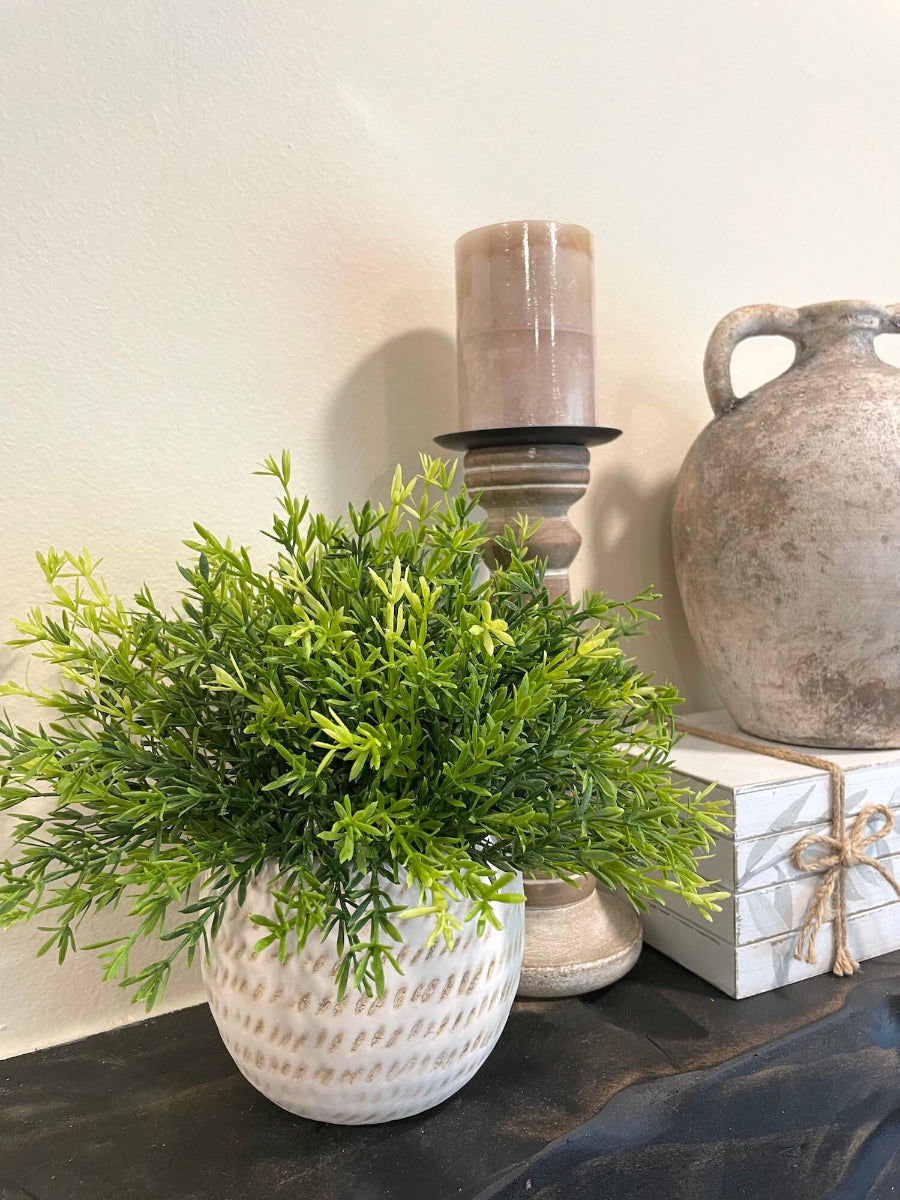 ealistic looking faux vivid greenery in ceramic pot