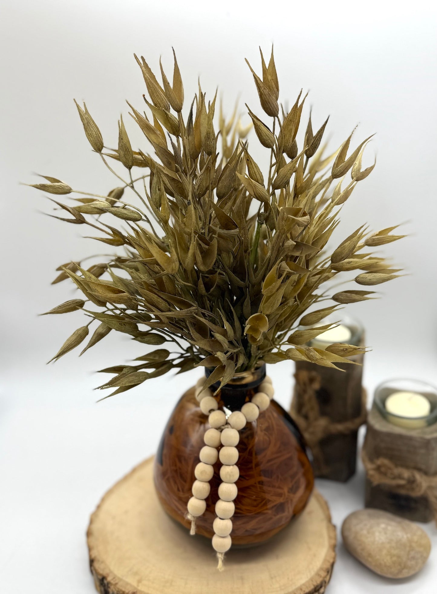 Faux Wheat Bouquet in Round Brown Bottle Vase