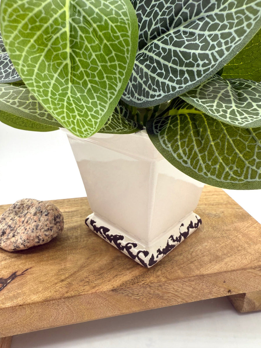 close up for white square ceramic pot vase with faux plant