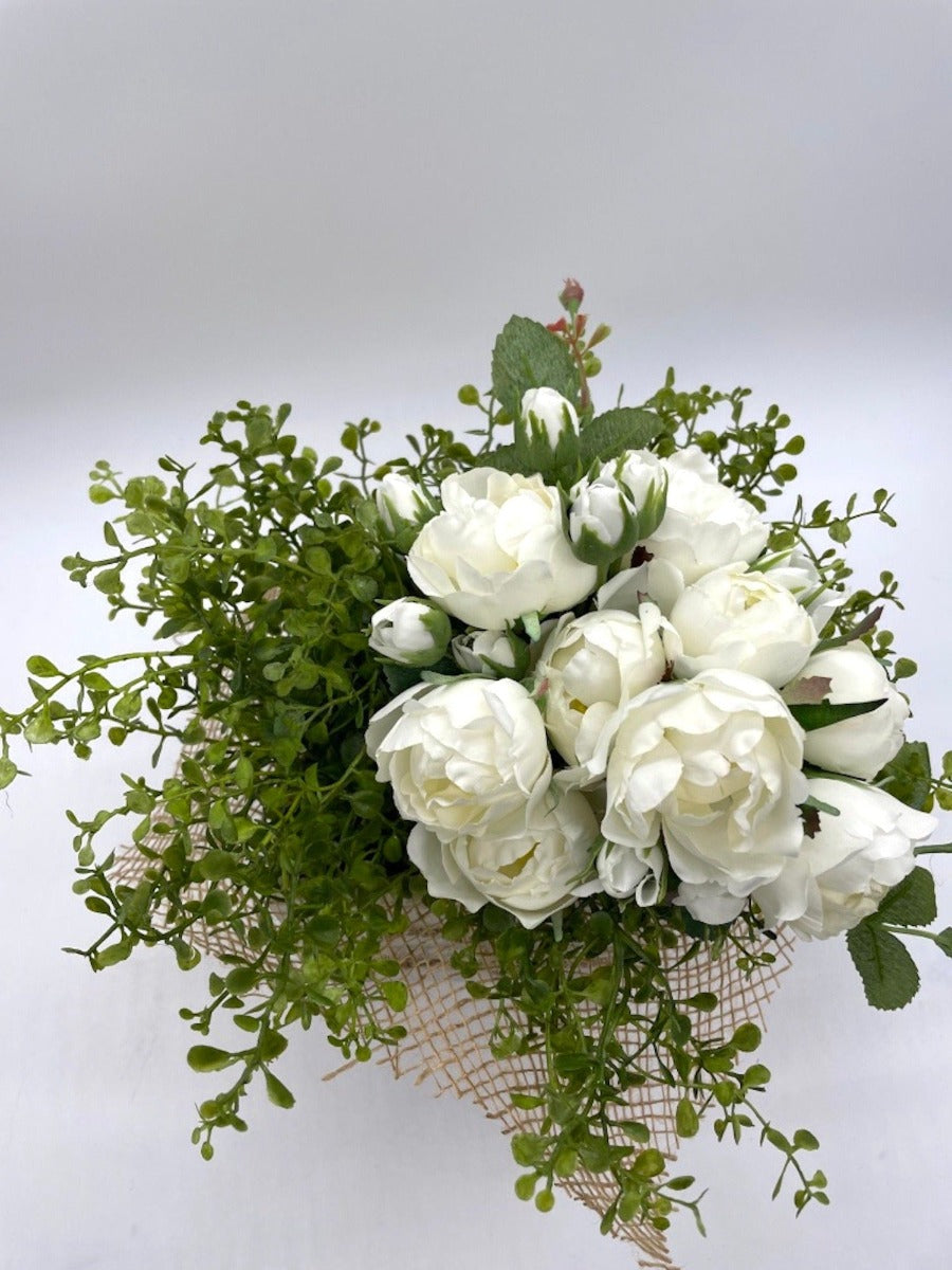 view from top of White Roses Arrangement, with realistic greenery n wooden whitewashed vase decorated with burlap and jute