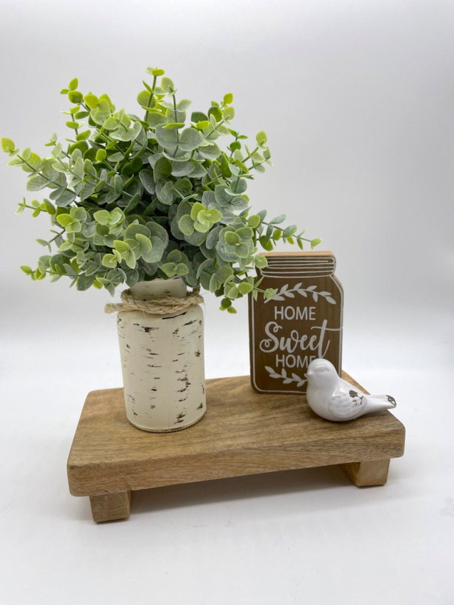 realistic faux Eucalyptus Arrangement in bottle vase painted in ivory and distressed and decorated with rope