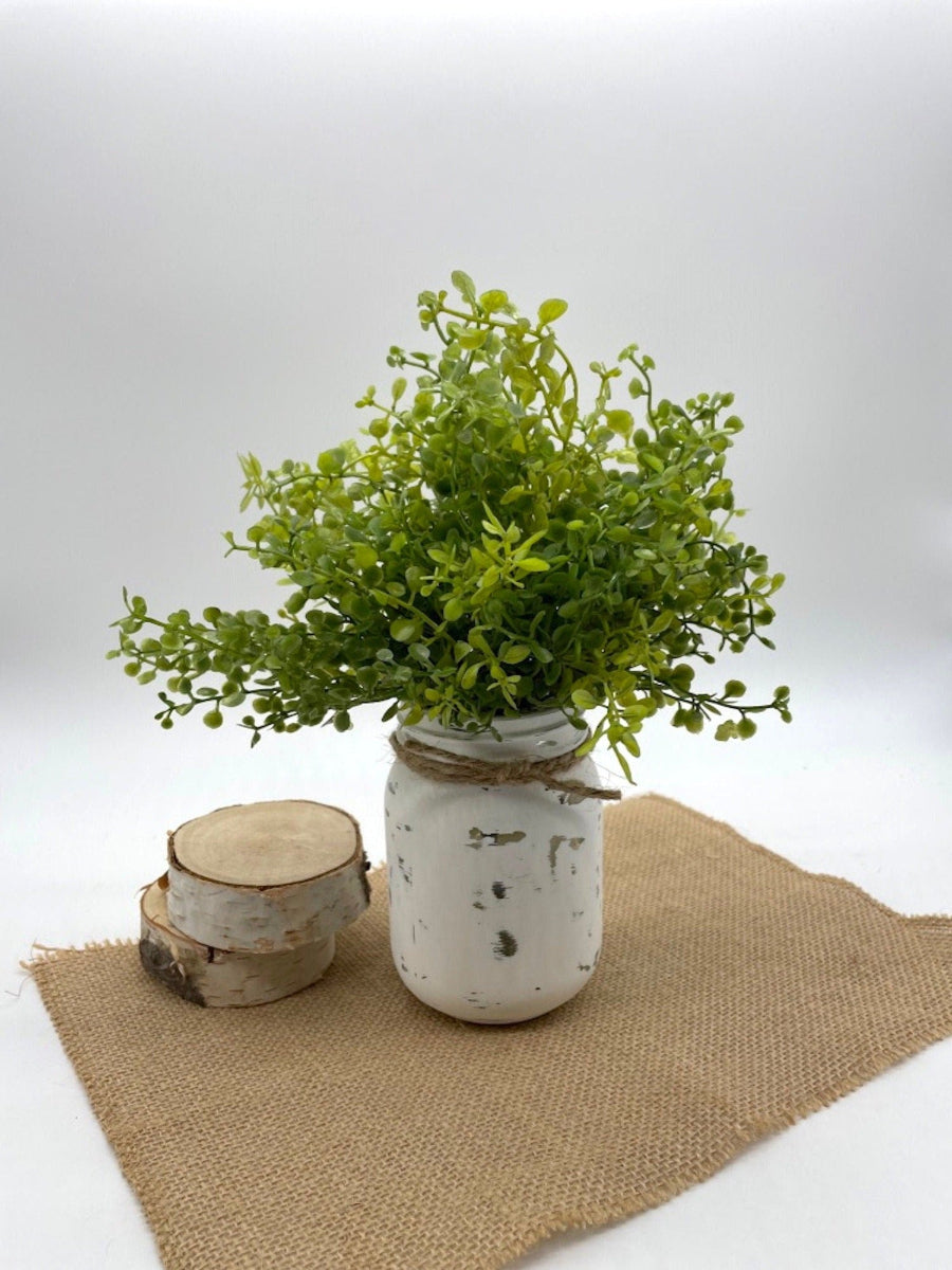 vivid green Fake Plant in Mason Jar painted in white and distressed and decorated with jute