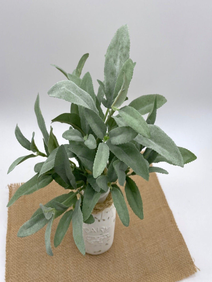 view from top, close up for realistic looking faux sage plant arrangement in Dairy bottle vase painted in white and distressed and decorated with rope