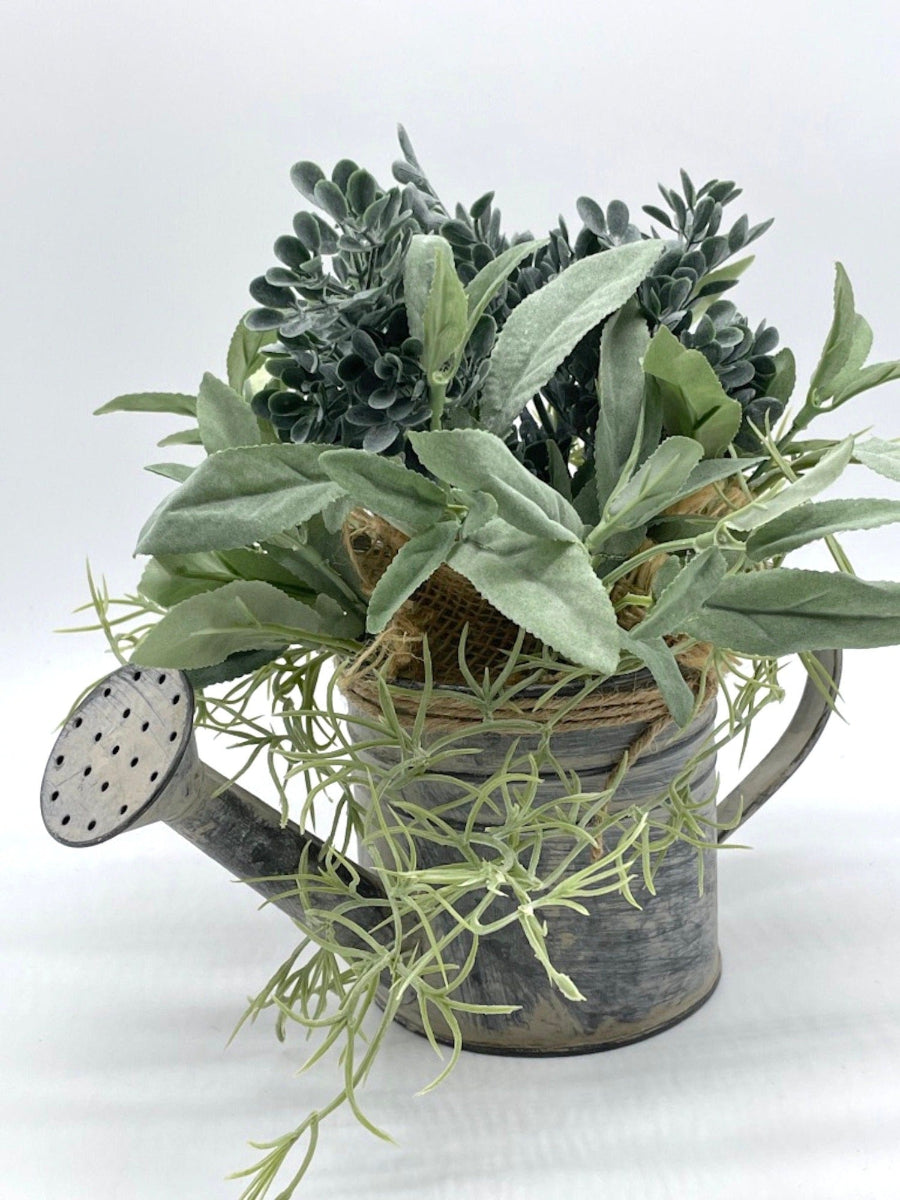 realistic Greenery Arrangement with 3 types of plants in dusty green in Metal Watering Can decorated with burlap and jute