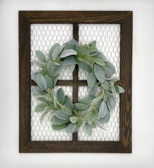 wooden window frame with chicken wire and decorated with lambs ear wreath